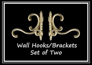 Set of two (2) scrolled wall hooks, in an antiqued painted white/cream 