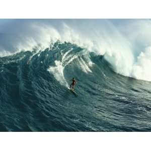  A Surfer Rides a Powerful Wave off the North Shore of Maui 