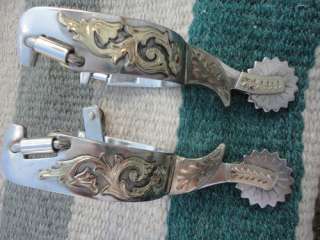 DOUBLE SILVER MOUNTED COWBOY SPURS WITH A NICE CHAP GUARDED SHANK AND 