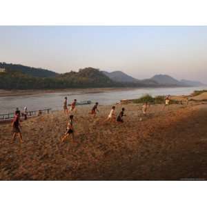 Playing Football on the Banks of the Mekong River, Luang Prabang, Laos 