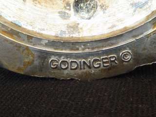 The holders have the fowling markings on the bottom GODINGER©