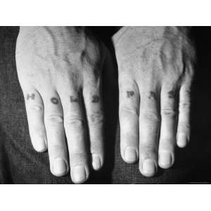  Knuckles of a US Sailor Displaying Tattooed Slogan Hold 