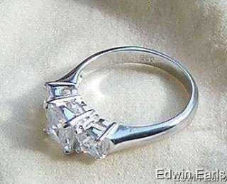 Beautiful designer style 3 stone princess cut ring. All stones are 