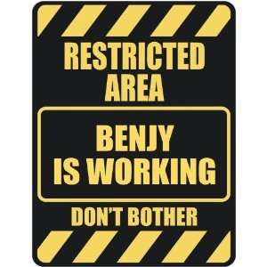   RESTRICTED AREA BENJY IS WORKING  PARKING SIGN