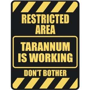   RESTRICTED AREA TARANNUM IS WORKING  PARKING SIGN