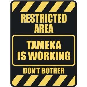   RESTRICTED AREA TAMEKA IS WORKING  PARKING SIGN