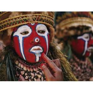  A Tribal Woman Decorated with Shell Necklaces and Bright 