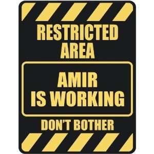   RESTRICTED AREA AMIR IS WORKING  PARKING SIGN