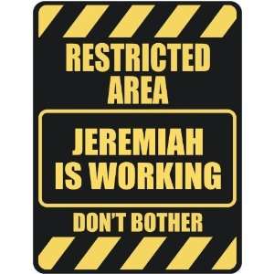   RESTRICTED AREA JEREMIAH IS WORKING  PARKING SIGN