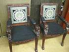 pair beautifully carved lionhead chairs medusa design on fabric 