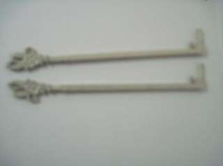 VINTAGE CURTAIN ROD PAIR WITH CAST IRON FLORAL ENDS/SWING ARM STYLE NO 