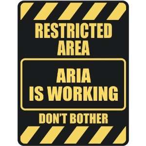     RESTRICTED AREA ARIA IS WORKING  PARKING SIGN
