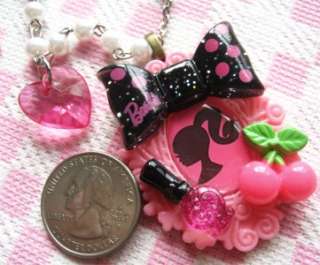 This item is a lovely handmade Barbie theme necklace. Pendant 