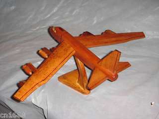 THIS IS AN B52 HAND MADE WOODEN MODEL AIRPLANE .