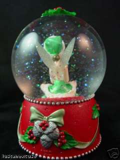 Tinker Bell is holding a snowflake in this  2004 snowglobe