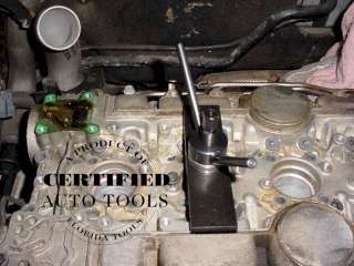 V550 5 This tool is to go over the 2 camshafts to hold them in the 