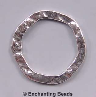 Antiqued. Hammered look. Texture on both sides. Closed rings. Sterling 